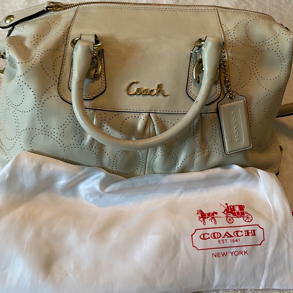 Coach ivory leather bag with the C’s cut out